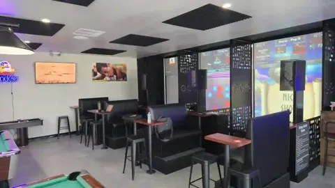 Krazy Darts booths lit up inside The 19th Hole